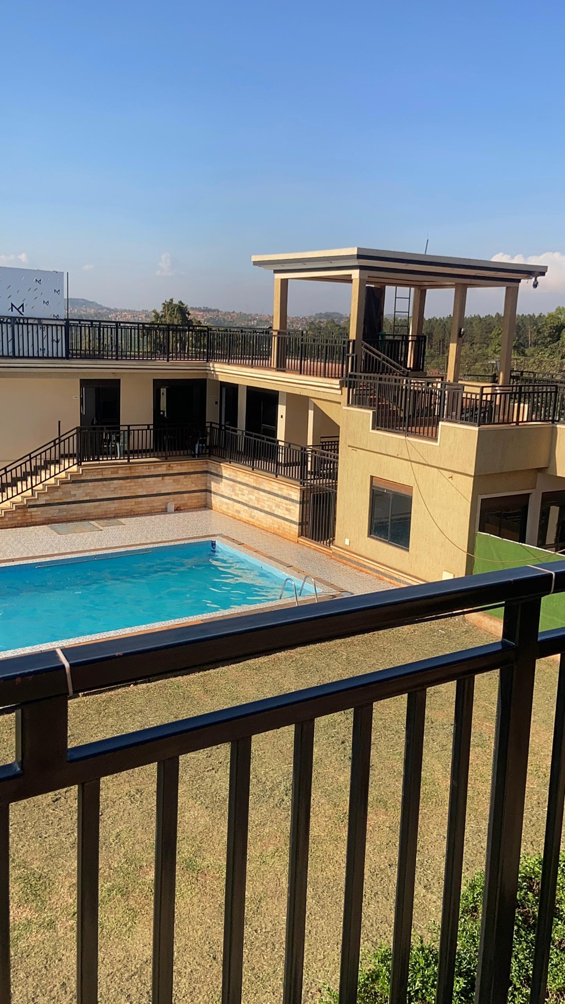Romil Gardens swimming pool and building
